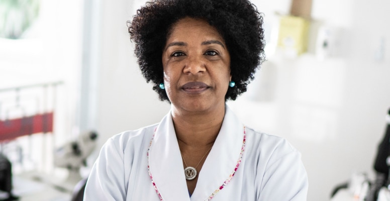 mature woman audiologist in a hearing lab